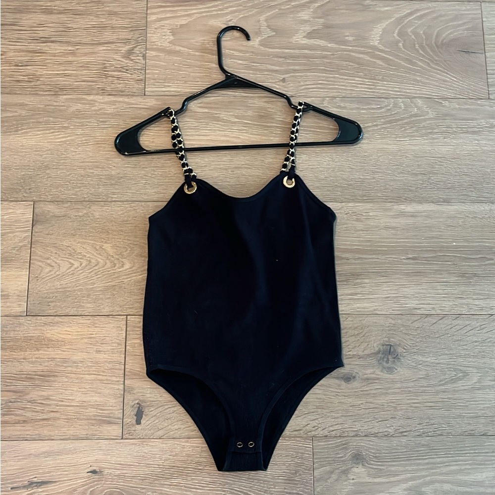 Black and gold bodysuit